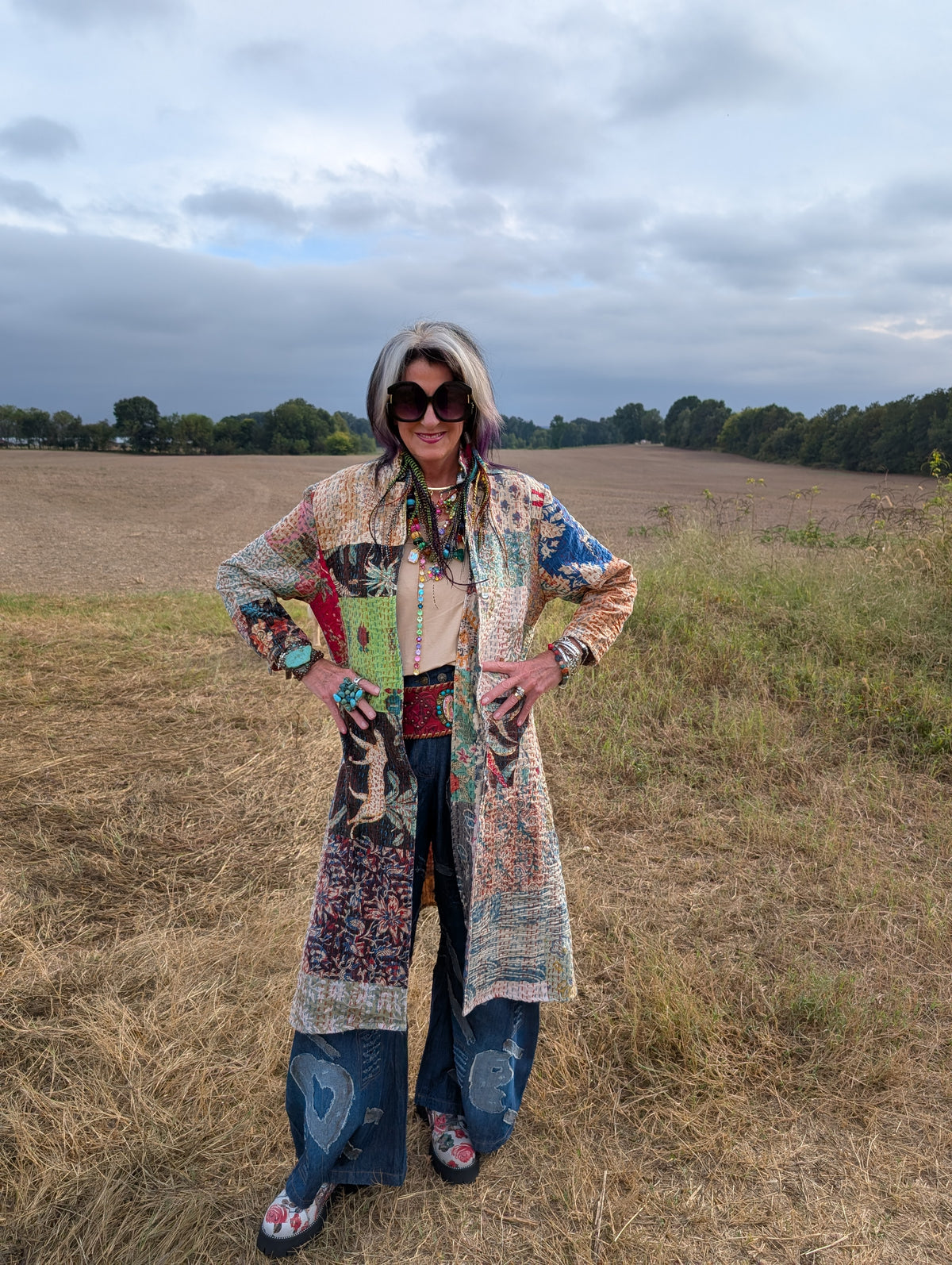 Wandering Soul Kantha Duster — Felecia Bella by paper lace, long colorful patchwork layer shown from the front with jeans and accessories.